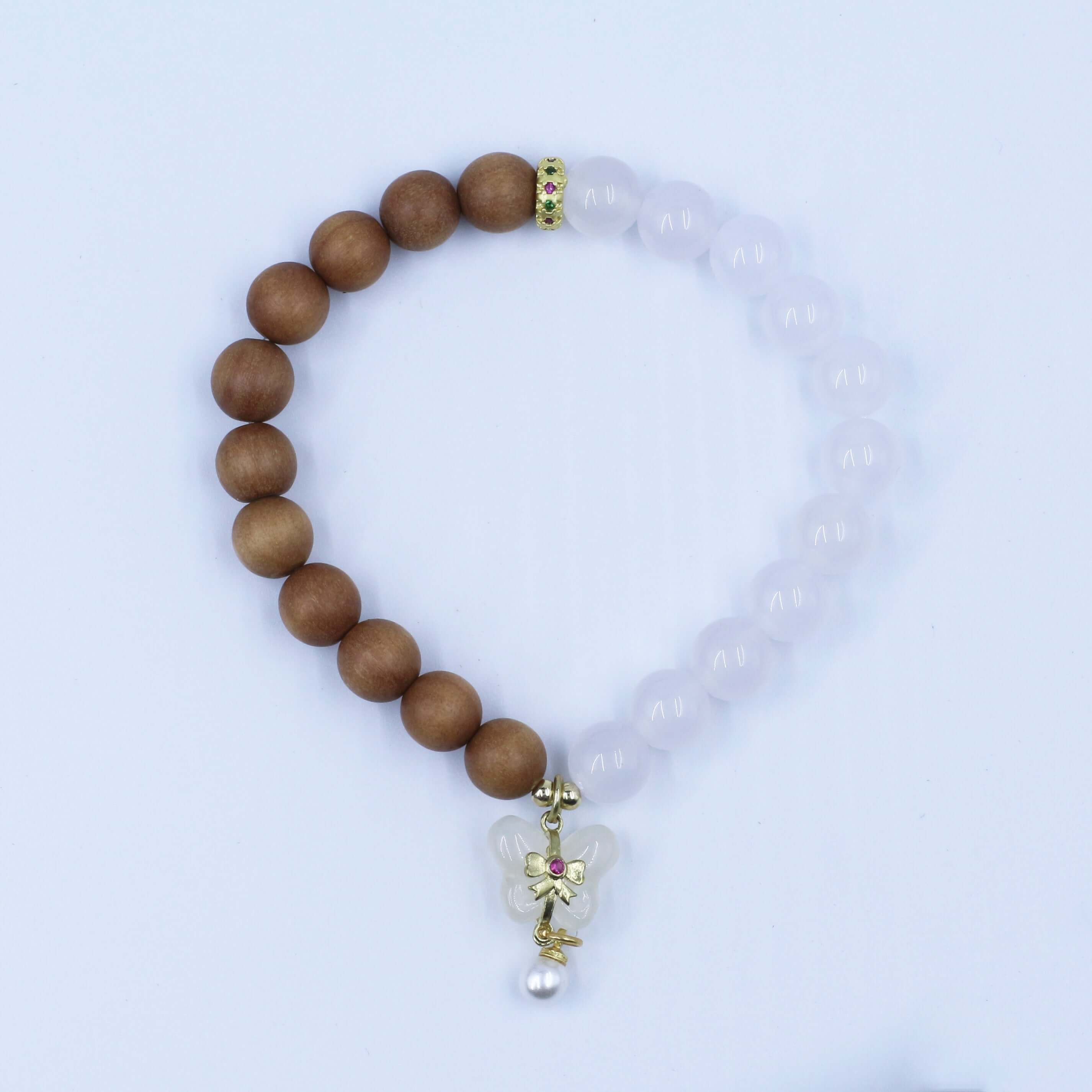 Double Purifying Butterfly Tassel Bracelet with sandalwood beads and butterfly charm for clarity and new life.