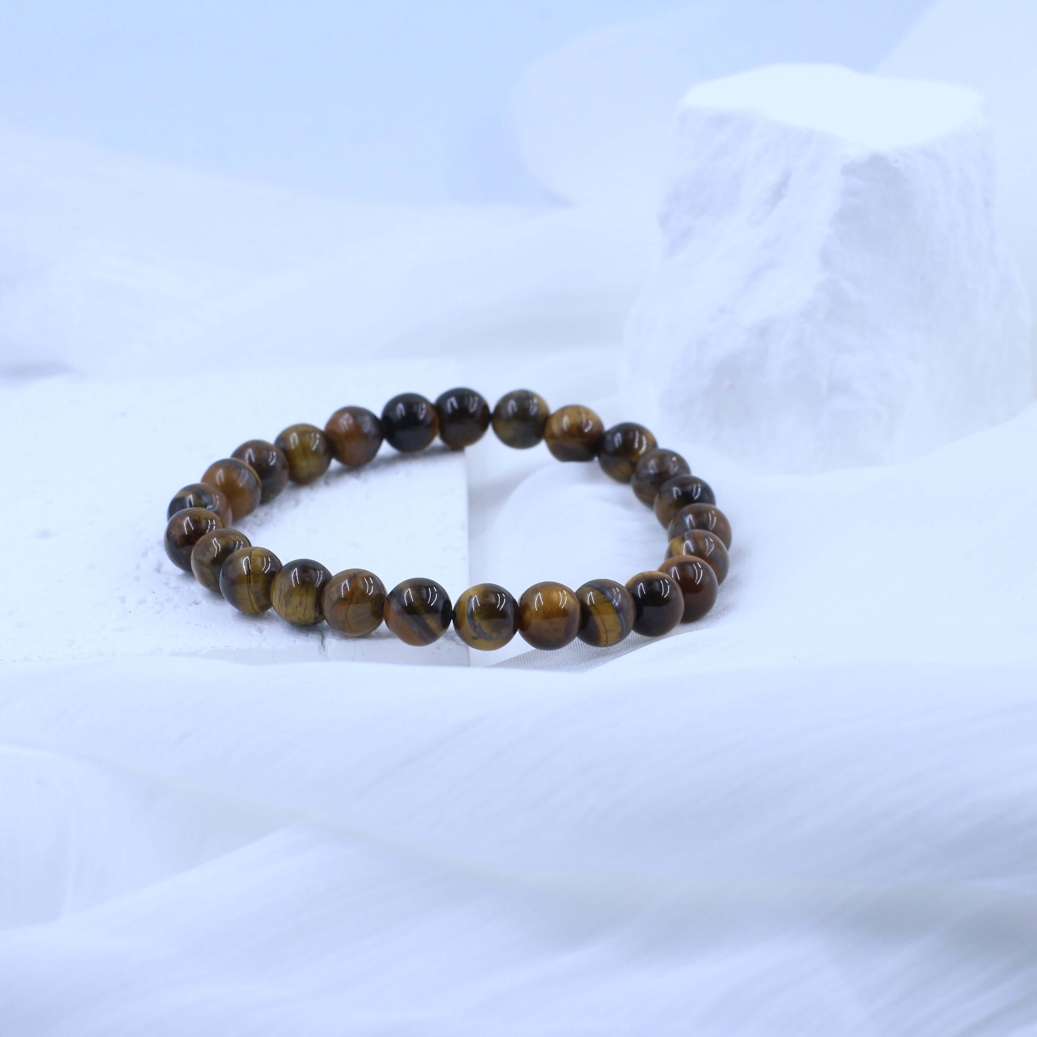 Classic Yellow Tiger's Eye Bracelet on white background, showcasing warm yellow hues and unique textures for spiritual strength.