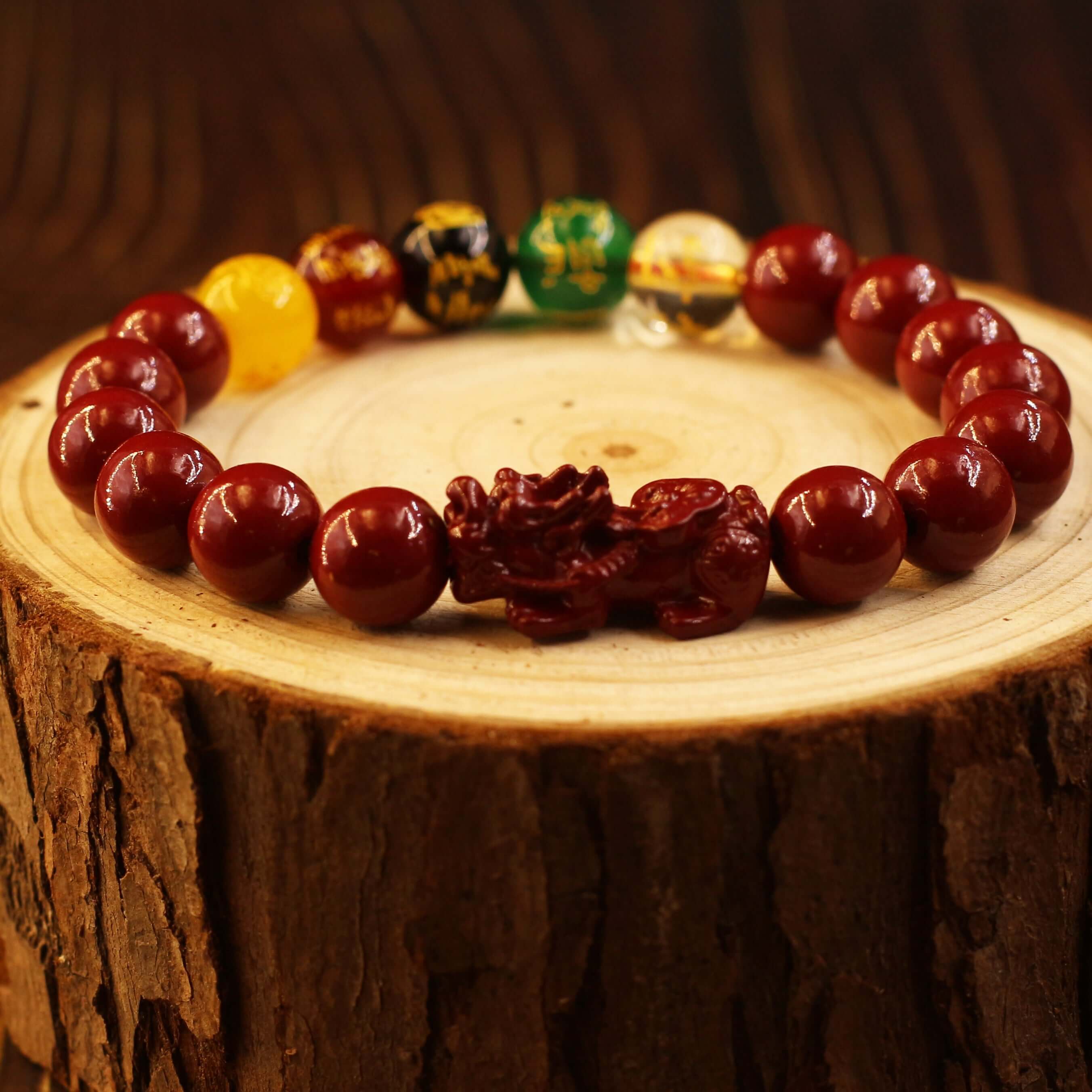 Five-way Gods of Wealth Bracelet with Pixiu and Cinnabar for Extreme Wealth on wooden surface